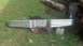 1983 Ford F-250 - A detached chrome truck bumper with a rusty hitch receiver is shown on the grass.