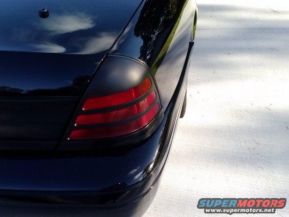 Black 2008 Ford Crown Victoria rear quarter panel and tail light