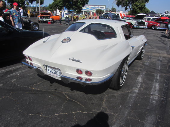 White 1963 Corvette coupe rear view with quad taillights and chrome bumper