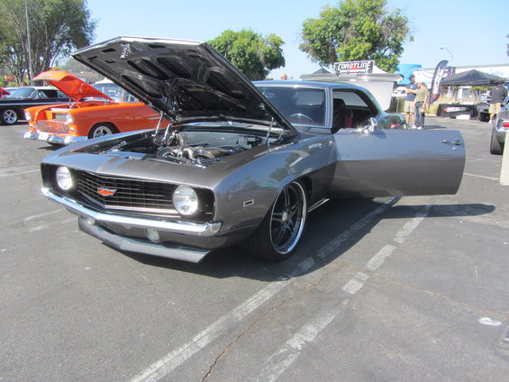 Gray 1969 Chevrolet Camaro, hood and door open, showing engine