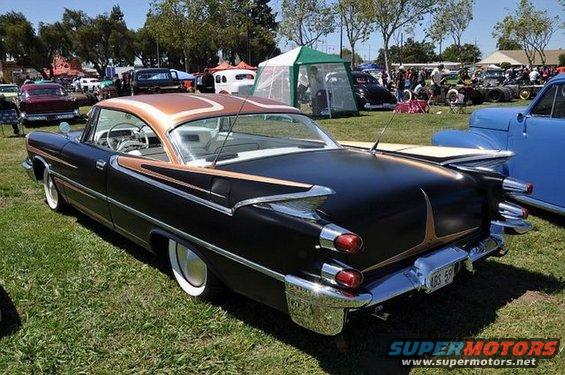Black and copper 1959 Dodge rear view with distinctive tail fins and chrome bumper