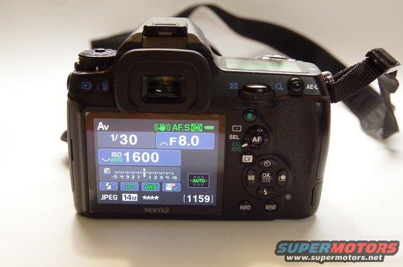 Rear view of a Pentax K-7 camera showing settings on its LCD screen