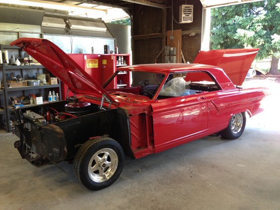 Red 1964 Ford Fairlane with hood and trunk open, showing interior and engine bay