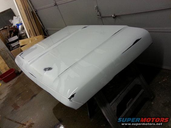 White 1967 Ford F-100 hood with damage