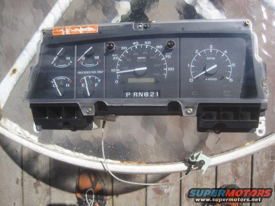 Dashboard gauges with speedometer, tachometer, fuel, and temperature. Shows PRND21 gear selection