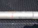 1999 Mercury Grand Marquis - Close-up of an exhaust pipe with a single red stripe marking, resting on a diamond plate surface.