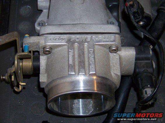 Close-up of a BBK Power-Plus throttle body with '70mm' and 'D-245-12' markings