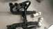 1990 WetJet Duo - Exhaust system parts, including headers and mufflers, laid out on a floor.