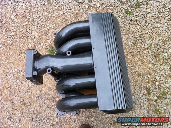 Gray intake manifold with four runners and a ribbed cover