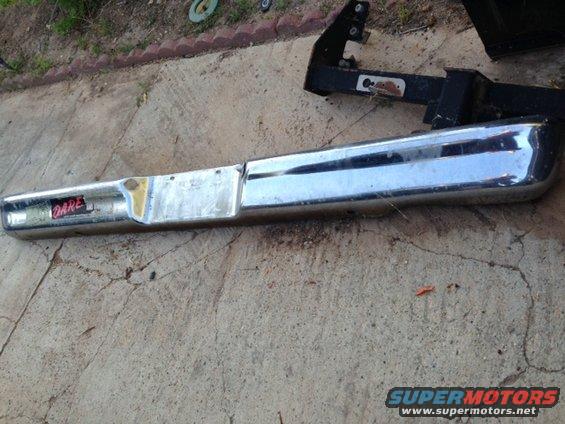 Chrome bumper with "DARE" sticker, mounted on a black bracket