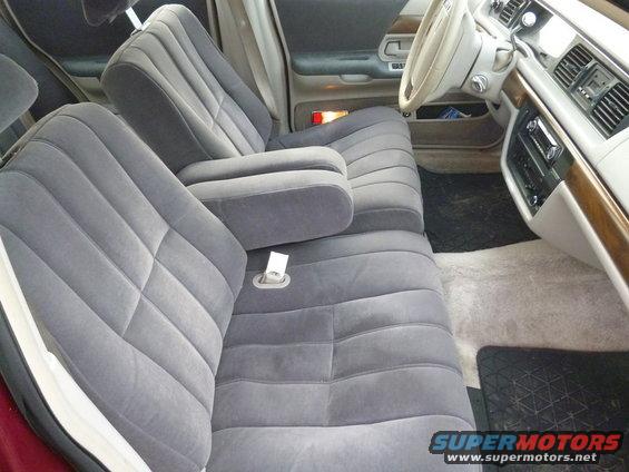 Gray velour interior of a 1992 Ford Crown Victoria, showing front seats, dashboard, and steering wheel