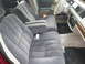1992 Ford Crown Victoria - The interior of a 1992 Ford Crown Victoria features gray velour seats and wood trim accents.