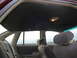 1992 Ford Crown Victoria - Interior view of a 1992 Ford Crown Victoria, focusing on the headliner and rear seating area.