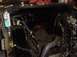 1995 Ford Mustang - The engine bay of a vehicle is shown, with a can of spray paint and various mechanical components visible.