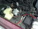 1992 Ford Crown Victoria - Close-up of a vehicle's engine bay, showing a fuel pump and various hoses and wires.