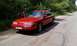 1992 Ford Crown Victoria - Red 1992 Ford Crown Victoria with driver's door ajar, parked on a rural road.