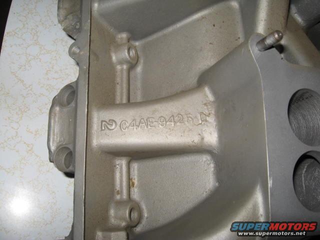 Close-up of a metal casting with C4AE-9425-D stamped on it
