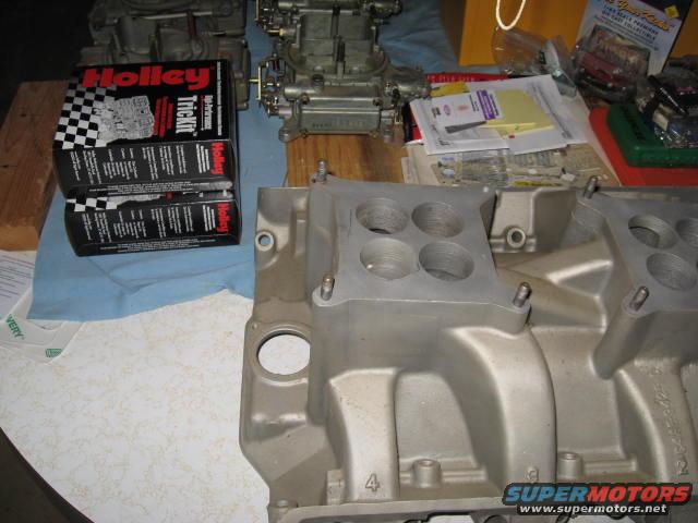 Aluminum intake manifold with four carburetors and Holley Trick Kit boxes