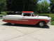 1958 Ford Ranchero - This two-tone 1958 Ford Ranchero features a distinctive side profile with its red lower body and white upper section, including the cab and…