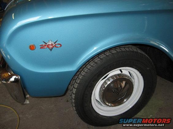 Blue fender with 260 badge and chrome bumper