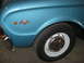 1963 Ford Ranchero - Close-up of a blue fender a '260' badge and a chrome bumper, with a white-rimmed wheel and tire visible.