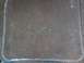 1991 Ford Bronco - Embossed 'Eddie Bauer' text on a clear plastic part, possibly from a vehicle interior.