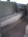 1991 Ford Bronco - The rear bench seat and carpeting of an older vehicle are shown.