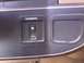 1991 Ford Bronco - Close-up of a vehicle's interior dashboard, showing an overdrive switch and an empty compartment.