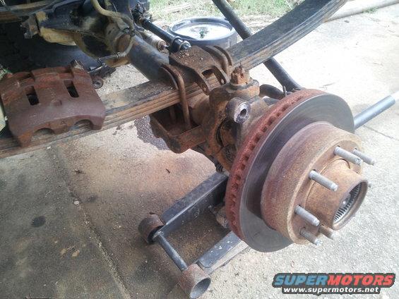 Rusty brake caliper and rotor assembly on leaf springs