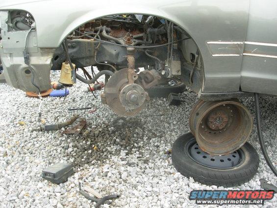 01left.jpg Someone had already snagged the caliper brackets, so a lot of the work was already done, including loosening the wheelwells.  I found the brackets on a nearby car without much effort.