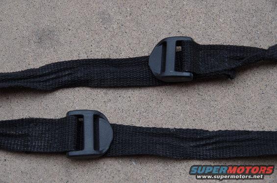 Two black fabric straps with black plastic buckles, one above the other. SuperMotors logo visible