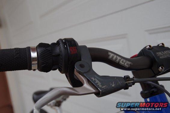 Bicycle handlebars with a grip shifter, XTR brake lever, and Titec branding