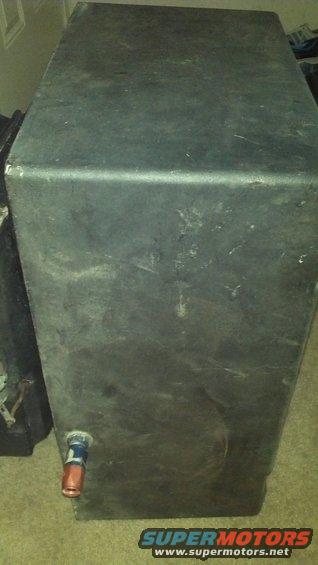 Black fuel tank with red and blue fitting