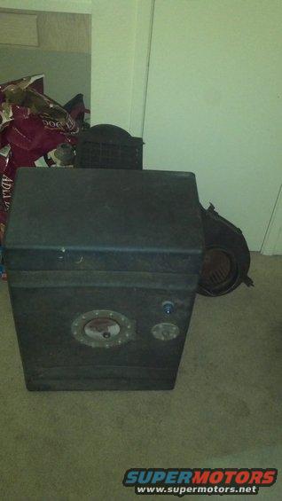 Rectangular metal fuel tank with circular access plate and two smaller circular fittings