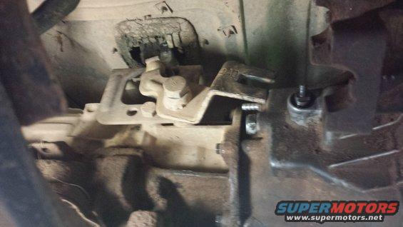 Transmission linkage with part number P-10 visible