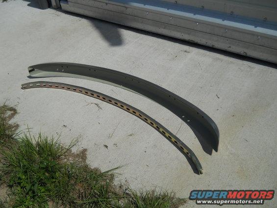 two curved metal trim pieces on concrete