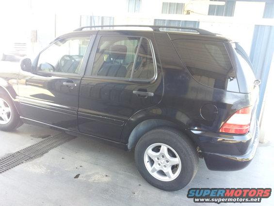 Black Mercedes-Benz ML-Class SUV parked indoors