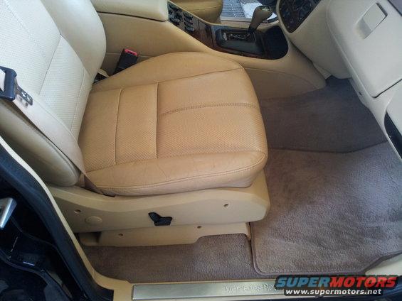 Tan perforated leather interior of a 2000 Mercedes-Benz ML-Class