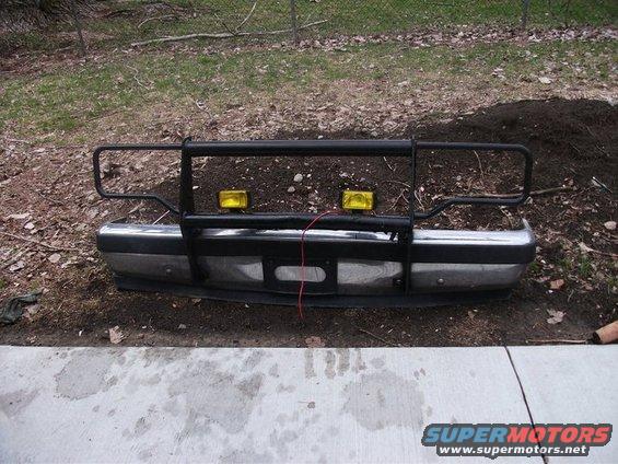 Front bumper with brush guard and yellow fog lights