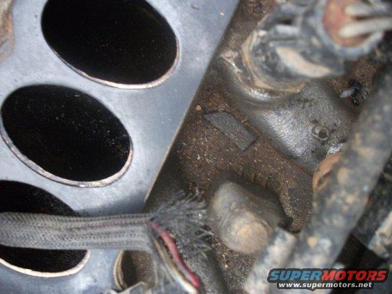 Engine block with two large oval openings and wiring harness