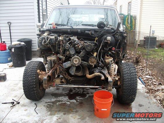 1990 Ford Bronco front end with engine removed, showing chassis and suspension