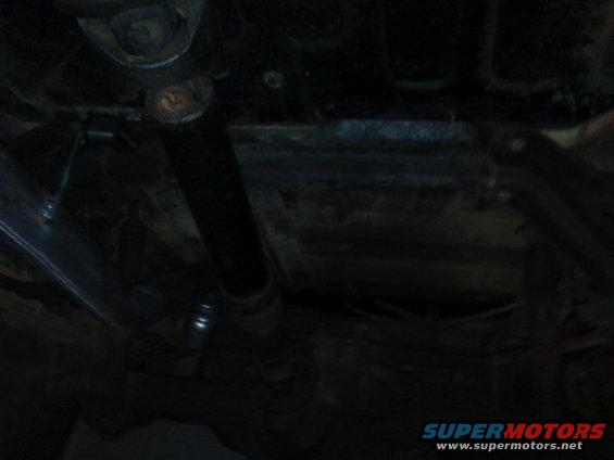 Underside of a vehicle, showing suspension components and frame