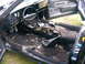 1975 Chevrolet Chevelle - The interior of the car is in disarray, with the carpet pulled up and trash scattered across the floor.