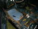 1975 Chevrolet Chevelle - The interior of a car shows significant rust and disarray, with tools scattered on the floor.