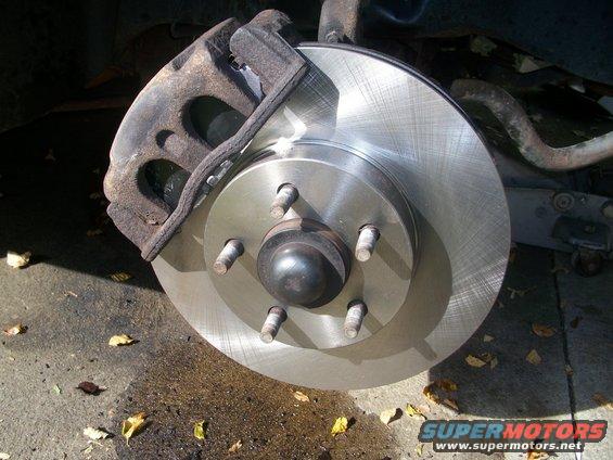 Close-up of a vehicle's brake rotor and caliper assembly