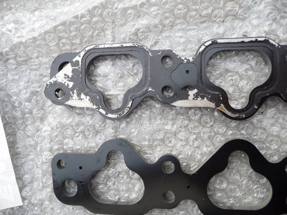 Engine gasket with worn sealing material