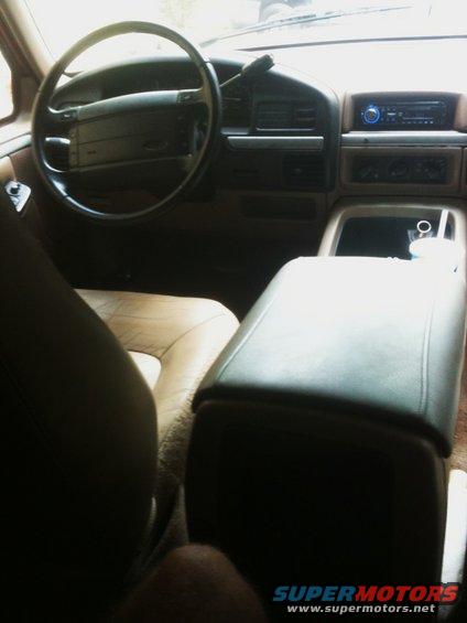 1994 Ford Bronco interior showing dashboard, steering wheel, center console, and seats