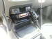2011 Ford Ranger - Interior view of a vehicle's center console showing a CB radio and accessories.