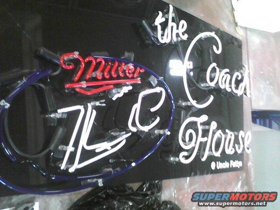 Neon sign with red 'Miller' and white text 'the Coach Horse' and 'Uncle Fatty's'
