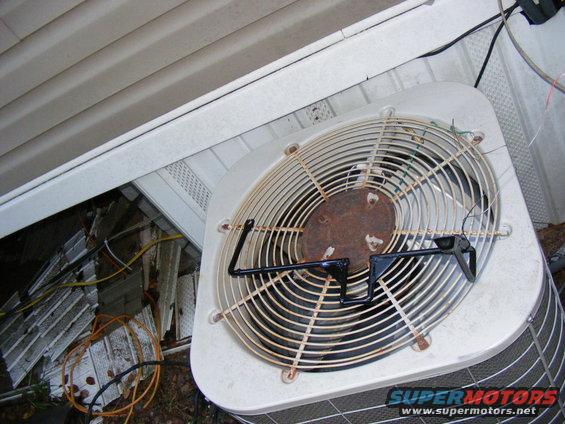 Air conditioning unit fan with Supermotors.net logo